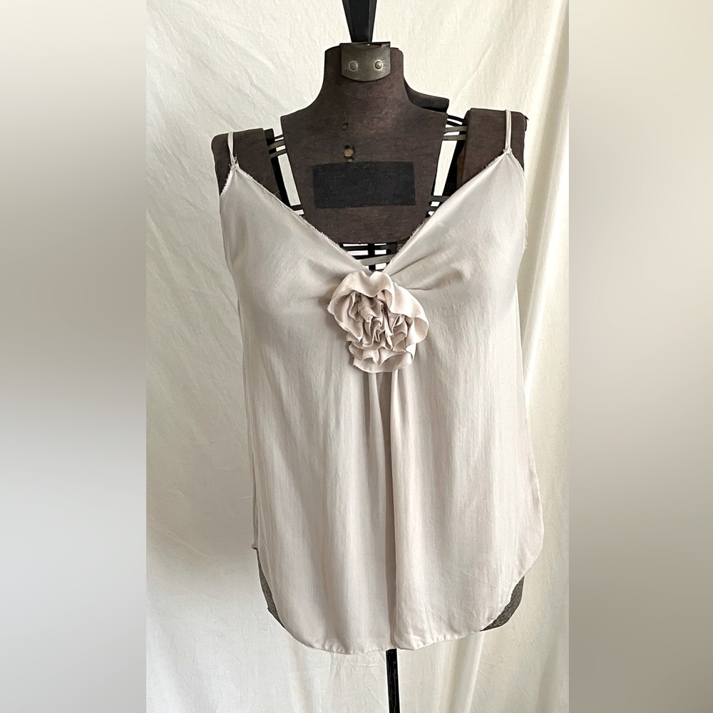 Rose colored very feminine tank top, with flower detailing in the middle.